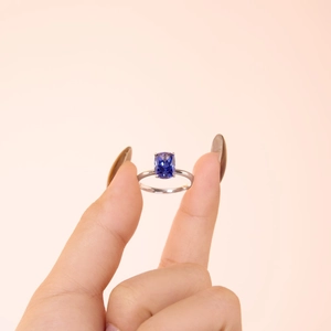 S925 sterling silver ring with cushion-cut dark blue gemstone in a minimalist four-prong setting