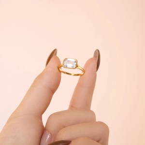Detail of emerald-cut white zircon set in gold plated S925 sterling silver ring