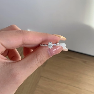 Elegance S925 sterling silver ring featuring oval moissanite and pave side stones