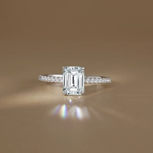 Elegant S925 silver ring featuring a 2-carat emerald cut stone with pavé setting detail