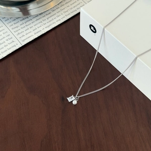 S925 sterling silver necklace with square cubic zirconia and white pearl on wood