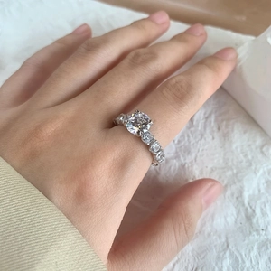 Detailed view of S925 sterling silver ring with 2 carat round sparkling diamond on hand