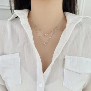 Minimalist double layer S925 sterling silver necklace featuring polished bead pendants