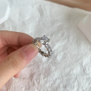 Close-up of S925 sterling silver ring with 2 carat sparkling round cut center diamond