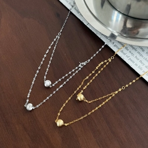 Double-layered 925 sterling silver necklace with matte round beads in gold and silver