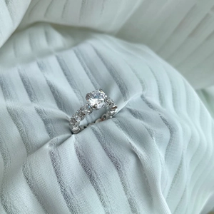 Macro view of S925 sterling silver ring featuring a 2-carat sparkling round brilliant diamond