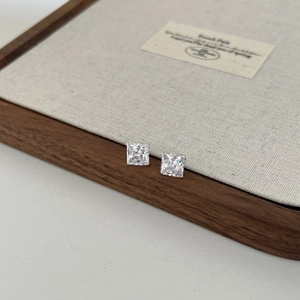 Macro view of 3ct square-cut cubic zirconia studs with classic four-prong setting