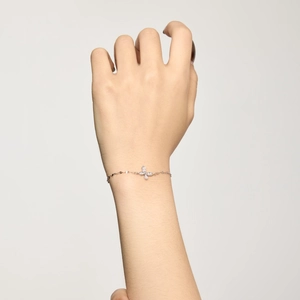 Detailed close-up of a delicate S925 silver butterfly bracelet with shimmering zircons