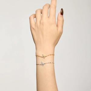 Elegant S925 sterling silver butterfly bracelets with small diamonds shown on a hand