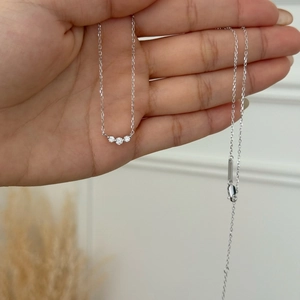 Elegant S925 sterling silver necklace featuring three sparkling round moissanite stones