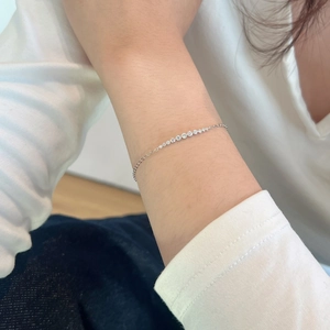 Detailed view of S925 sterling silver smile bracelet with graduated Moissanite stones