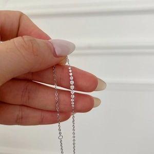 Exquisite S925 sterling silver necklace featuring a vertical row of D color moissanite stones