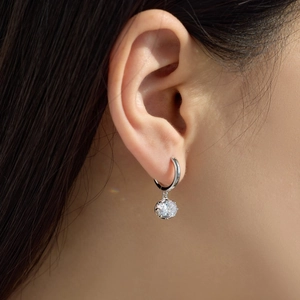 Macro view of S925 sterling silver drop earring featuring a brilliant six-prong set stone
