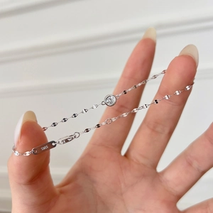 Detailed shot of S925 sterling silver bracelet featuring a round bezel-set solitaire stone