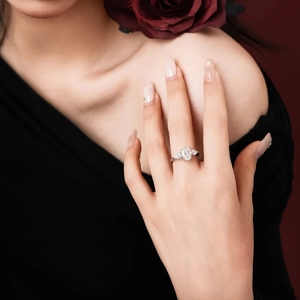 Detailed view of an S925 silver ring with 3.5 carat oval and pear-cut moissanite stones