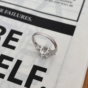 S925 sterling silver ring featuring a 3.5 carat oval moissanite stone and side gems