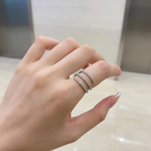 Close-up of S925 sterling silver triple wrap ring with white cubic zirconia pavé stones