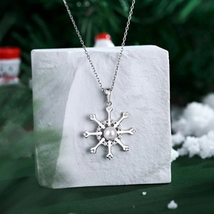 Elegant S925 sterling silver snowflake pendant necklace with a central pearl and zircons