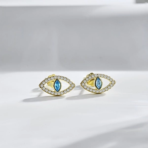 Boucles d'oreilles clous œil porte-bonheur en argent S925 et zircone bleue