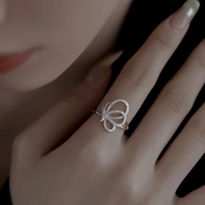 Close-up of S925 sterling silver butterfly ring with shimmering zircon inlays