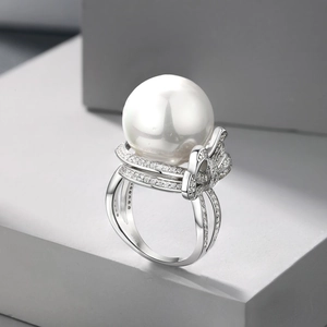 S925 sterling silver bow ring with a large white pearl and sparkling zircon pavé