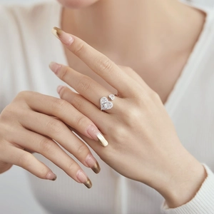 Close-up of S925 sterling silver heart ring with sparkling pavé zircon stones on finger