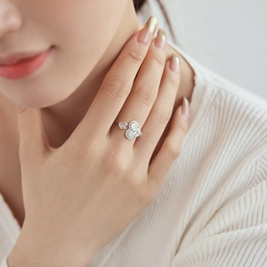 Close-up of S925 silver adjustable heart ring with sparkling zircon inlays on hand