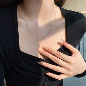 Minimalist S925 sterling silver chain necklace for women worn on a black square neck top