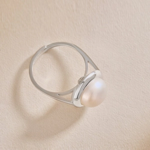 Detailed view of an S925 silver ring featuring a large natural freshwater pearl and open band