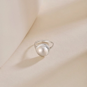 Macro detail of natural freshwater pearl on an adjustable S925 sterling silver ring