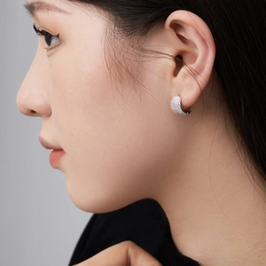 925 sterling silver U-shaped hoop earrings with micro-set zircon crystals on model