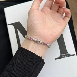 Detail of S925 sterling silver bracelet with colorful cubic zirconia flower clusters