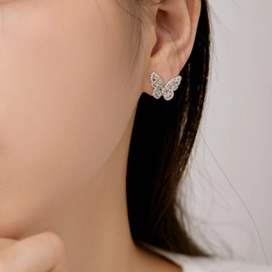 Macro view of sterling silver butterfly earring with shimmering cubic zirconia stones