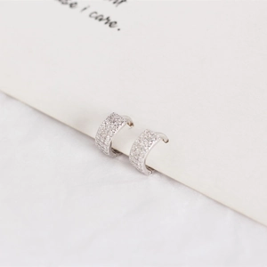 Close-up of S925 sterling silver U-shaped hoop earrings with sparkling zircon paving