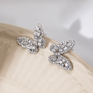 Detailed close-up of S925 sterling silver butterfly earrings with sparkling zircon inlay