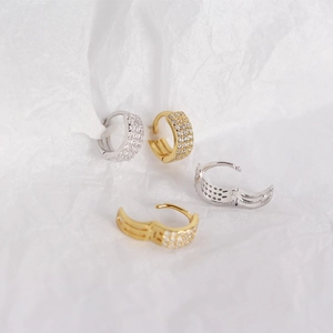 Detailed macro of S925 sterling silver U-shaped hoop earrings with zircon pavé setting