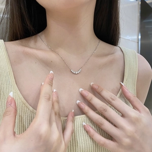Minimalist S925 sterling silver U-shaped necklace with sparkling zircon stones on a model