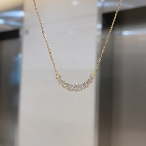 Detail view of the S925 silver U-shape pendant with seven sparkling white zircons