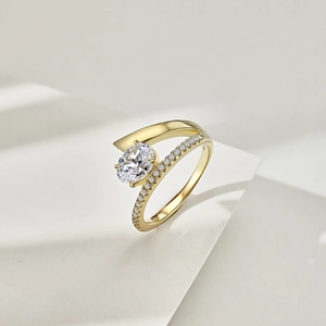 Detail view of oval cut gemstone ring with gold pavé band and elegant shadow