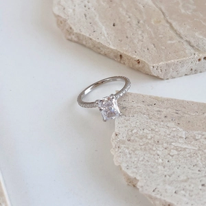 Detailed close-up of S925 silver ring featuring a large rectangular ice-cut zircon stone