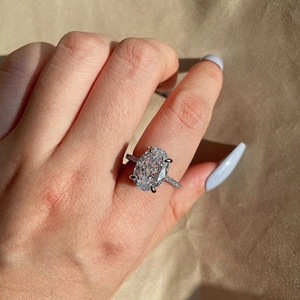 Macro view of S925 silver ring featuring an oval-cut stone in a classic 4-prong setting