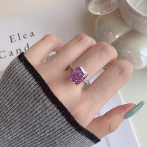 Detailed view of S925 silver ring with large radiant-cut pink zircon worn on a finger