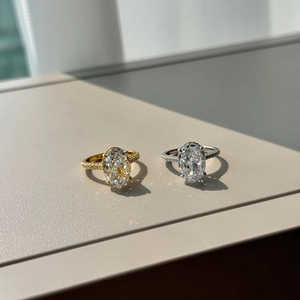 Close-up of S925 silver rings with oval crushed ice cut zircon and paved side stones