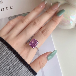 Macro shot of s925 silver ring featuring radiant cut pink gemstone and pavé diamonds