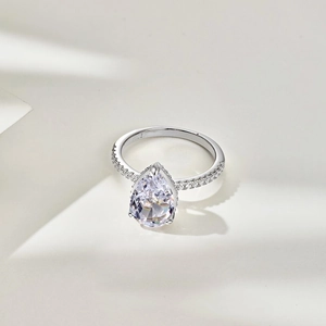 Close-up of S925 sterling silver ring with pear-cut stone and fine pavé diamond details