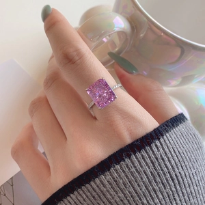 Luxury S925 silver ring featuring a large radiant cut pink stone on a model's hand