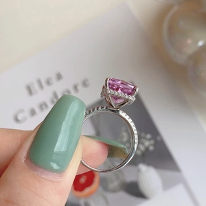 Detail view of pink radiant cut gemstone ring with micro-pave diamond setting in silver