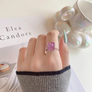 Elegant s925 silver ring featuring a large radiant cut pink gemstone and pave diamonds