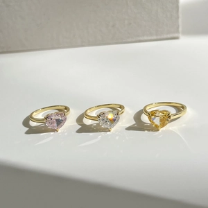 Three luxury S925 silver heart-shaped rings with pink, white and yellow zircons