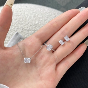 Macro shot of S925 silver jewelry set with radiant cut rectangle stones and pavé accents